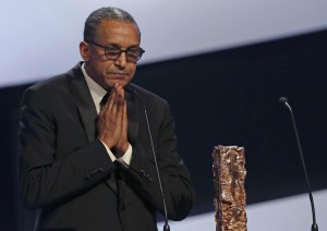 Director Abderrahmane Sissako reacts next to his trophy after winning the Best Director Award for the film "Timbuktu" at the 40th Cesar Awards ceremony in Paris February 20, 2015. REUTERS/Philippe Wojazer (FRANCE - Tags: ENTERTAINMENT)