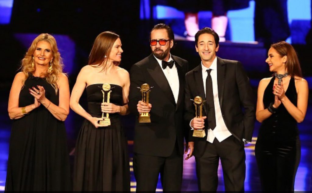Nicolas Cage, Hilary Swank et Adrien Brody, avec Youssra et Nelly Karim à la cérémonie de clôture du CIFF