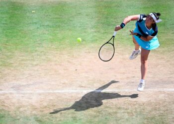Tunisia's Ons Jabeur serves a ball to US' Coco Gauff during the semifinal the Bett1 open tennis tournament at the Steffi-Graf-Station in Berlin on June 18, 2022. (Photo by Tobias SCHWARZ / AFP) (Photo by TOBIAS SCHWARZ/AFP via Getty Images)