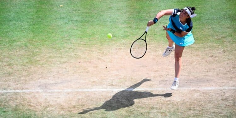 Tunisia's Ons Jabeur serves a ball to US' Coco Gauff during the semifinal the Bett1 open tennis tournament at the Steffi-Graf-Station in Berlin on June 18, 2022. (Photo by Tobias SCHWARZ / AFP) (Photo by TOBIAS SCHWARZ/AFP via Getty Images)