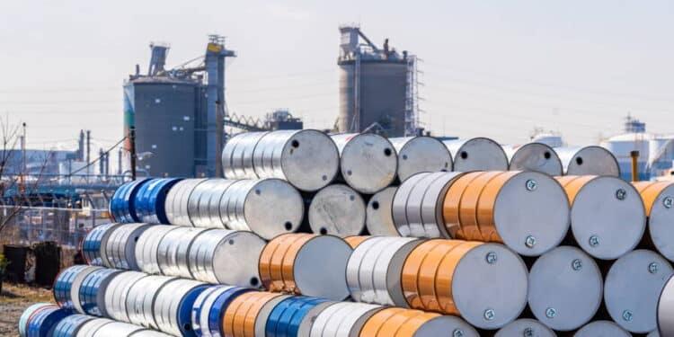 Industry oil chemical metal barrels stacked up in waste yard of tank and container, Kawasaki city near Tokyo Japan