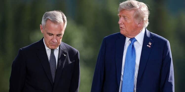Prime Minister Mark Carney, left, listens to U.S. President Donald Trump while posing for the family photograph during the G7 Summit in Kananaskis, Alta., Monday, June 16, 2025. The Canadian Press/ABACAPRESS.COM//Darryl Dyck