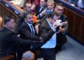 Security officials remove a Knesset member who interrupted President Donald Trump speech to the Knesset, Israel's parliament, Monday, Oct. 13, 2025, in Jerusalem.     Evan Vucci/Pool via REUTERS