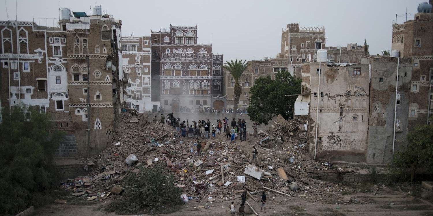 Rescuers, mostly neighbors and local men, attempt to dig a family out of a collapsed home after a Saudi-led arirstrike in the old city of Sanaa, Yemen on Friday, June 12, 2015. (AP Photo/Alex Potter)/CAIMA101/818291956095/1506121249
