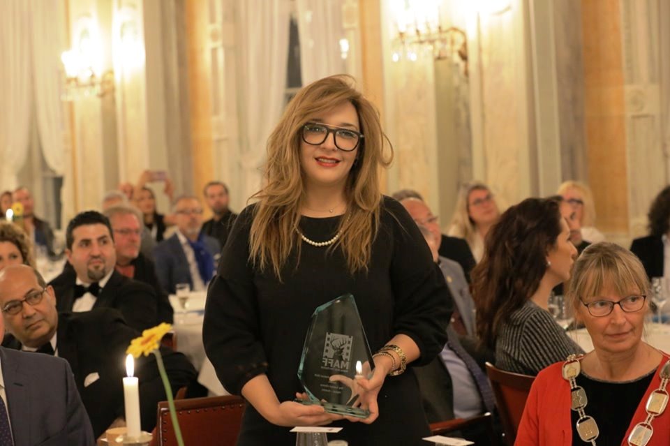 Karima Amirat reçoit le trophée au nom du CNCI